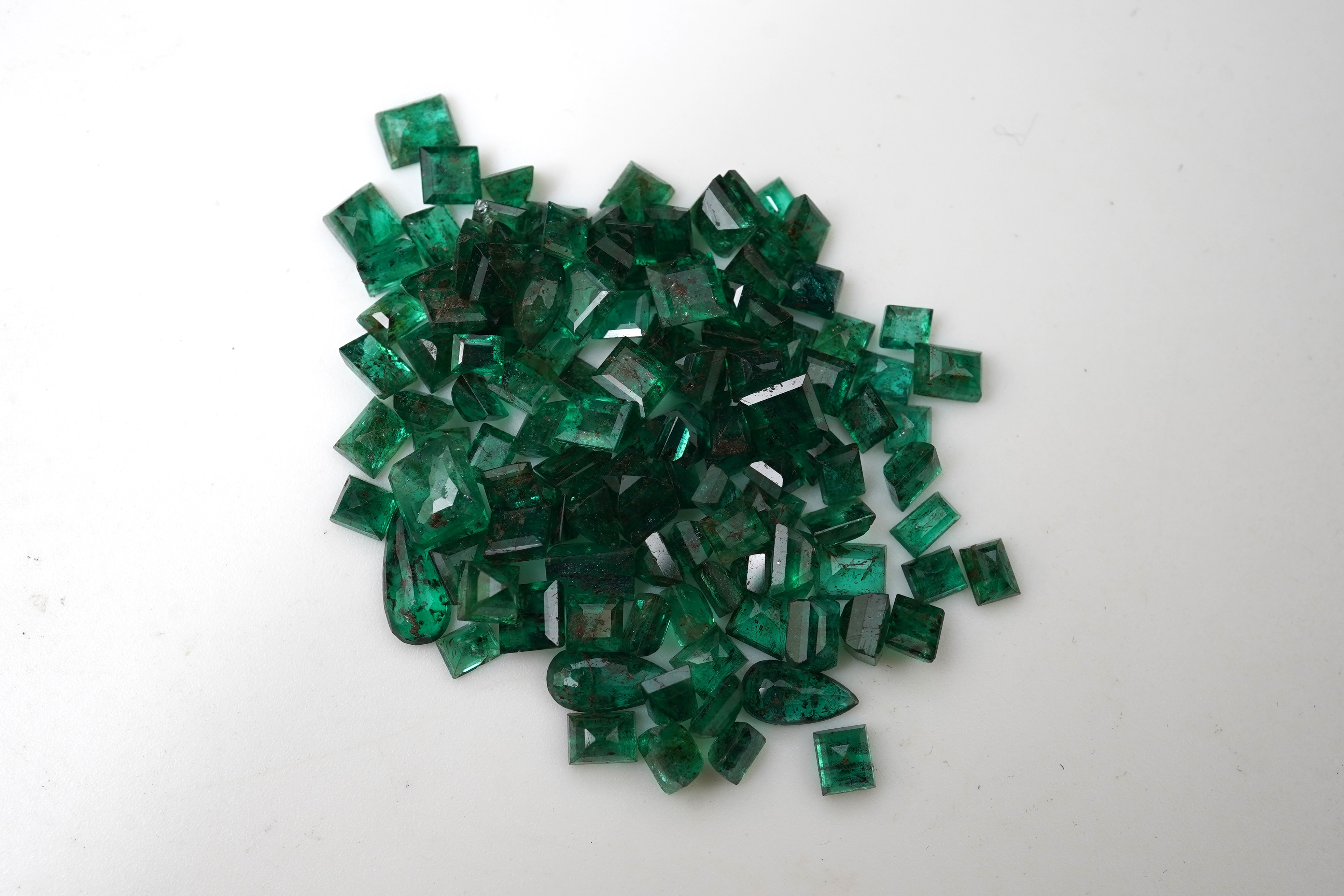A collection of loose emeralds